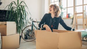 Woman with a box to packing things