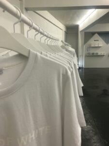 white organized t-shirts in a clean store